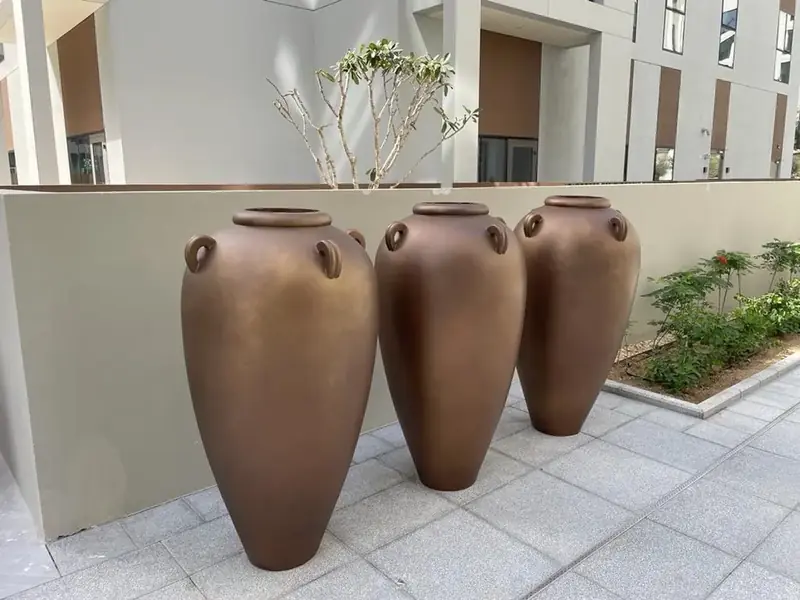 Large custom planters in a courtyard